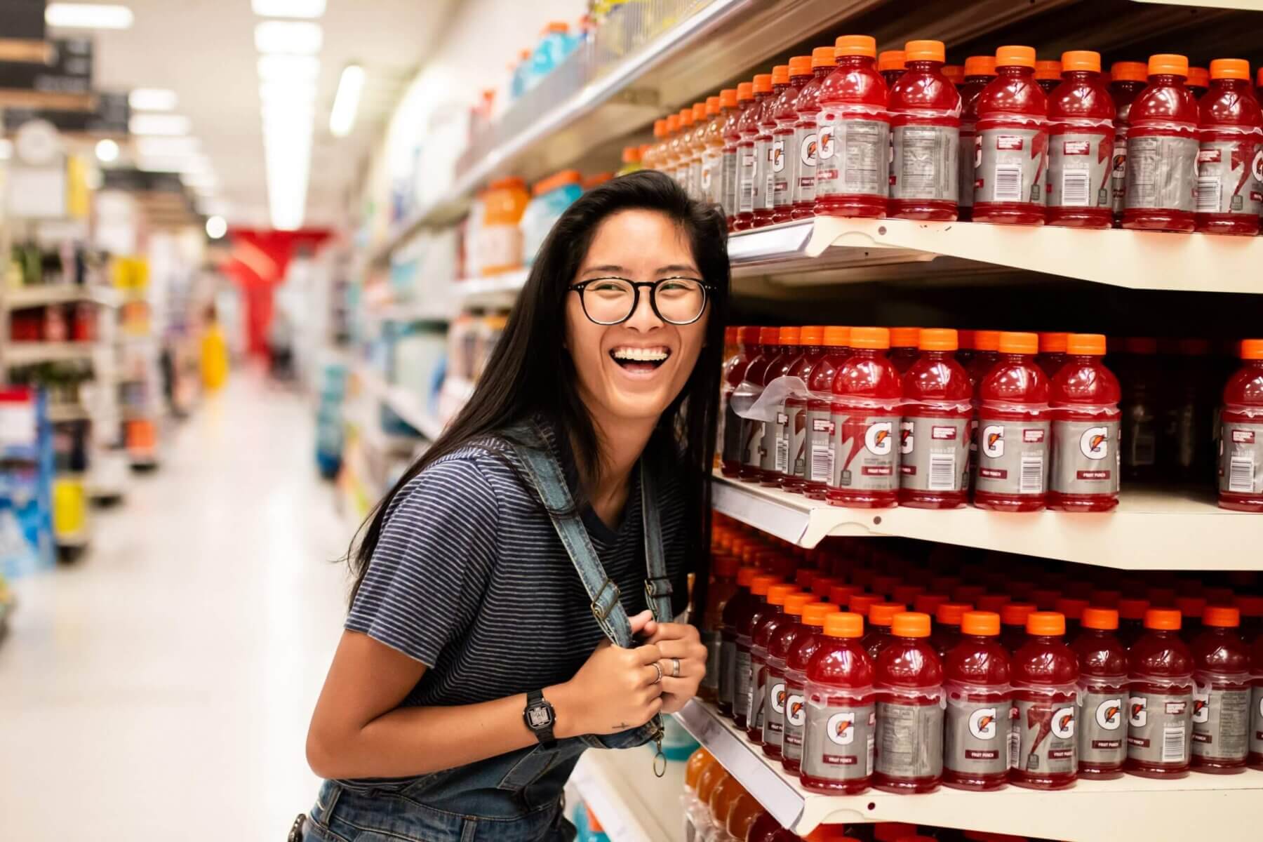 Women Smiling Next to Gatorade Bottles